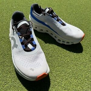 On Running CloudMonster White Blue Athletic Shoes with Orange Accents